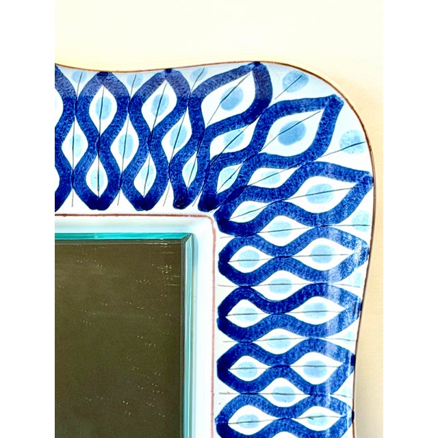 Beautiful 1940’s-50’s Swedish Faience ceramic mirror by Stig Lindberg for Gustavsberg. A thick and milky white heavy...