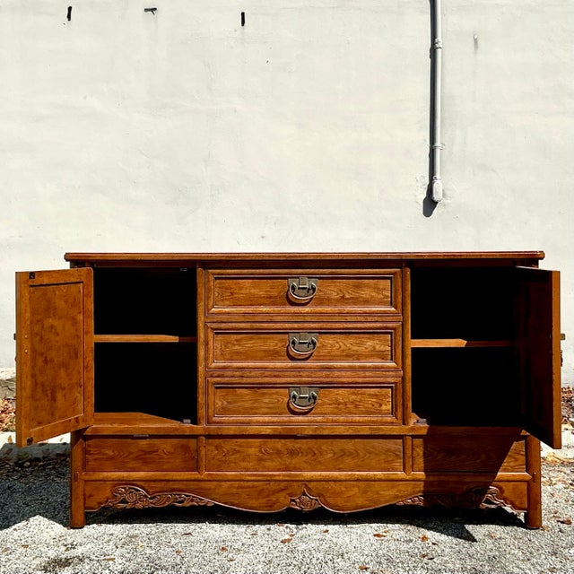 Bring a blend of vintage sophistication and boho charm to your space with this Vintage Boho Hickory White Credenza....