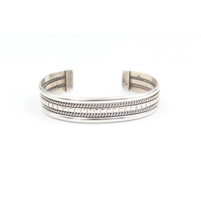 Navajo “TAHE” Sterling Silver Stacked-Wire Cuff Bracelet Distinctive Navajo cuff bracelet stamped “TAHE,” featuring a...