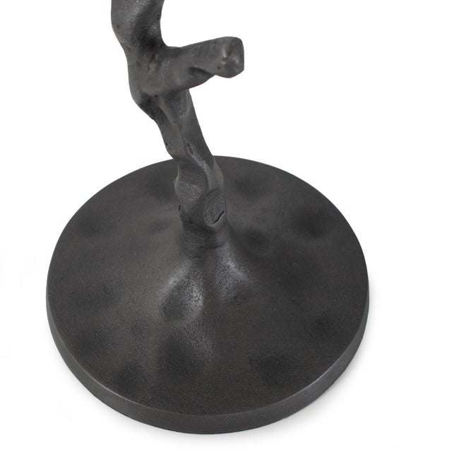One gnarly twisted branch from the local botanical gardens became the inspiration for candlesticks. Interpreted in cast...