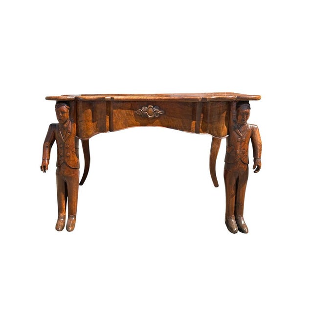The piece features a richly shaped top decorated with geometric and floral inlays, a wavy edge, and a warm wood patina....