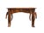 The piece features a richly shaped top decorated with geometric and floral inlays, a wavy edge, and a warm wood patina....