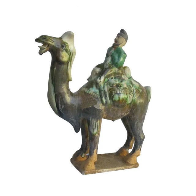 This is a hand made oriental ancient style camel figure in vintage finish. Dimensions: 9.5"x 4"x h11.5" Origin: China...