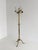Elegant vintage brass coat rack featuring a smoothly rotating crown, richly decorated hooks, a refined fluted column, and...