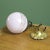 Antique hanging lamp with brass fixture in Art Deco style. The lamp has a pink marbled glass shade which gives a very...
