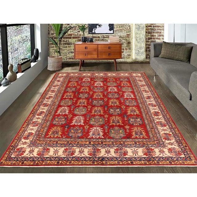 Embellish your home with this exquisitely hand-knotted Super Kazak Rug made with the finest hand spun wool and all...