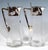Two carafes made of clear glass with a conical body, the inner walls featuring a six-rayed, wavy thickening, a cut star on...