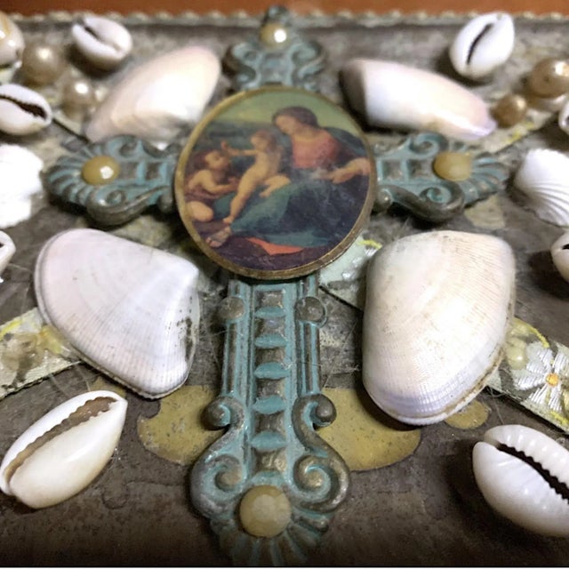 This beautiful hand decorated keepsake box has a beautiful green velvet on the outside. The top shows a metal cross with...