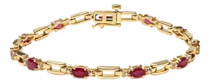10K Yellow Gold Oval Ruby and 1/10 Cttw Diamond Bar Prong Set Bracelet (H-I Color, SI1-SI2 Clarity) - Size 7"