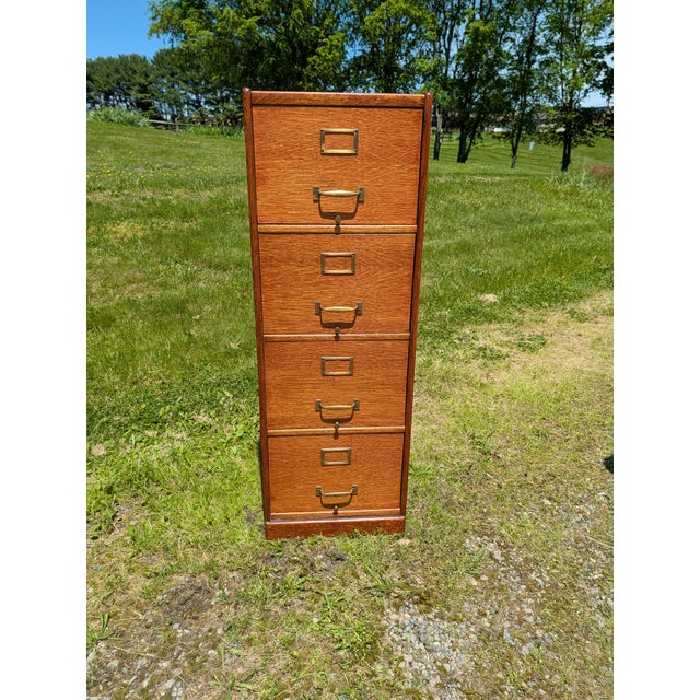 Antique Quarter Sawn Oak Four Drawer File Cabinet 1920s An antique quarter sawn oak four drawer file cabinet. Dates back...