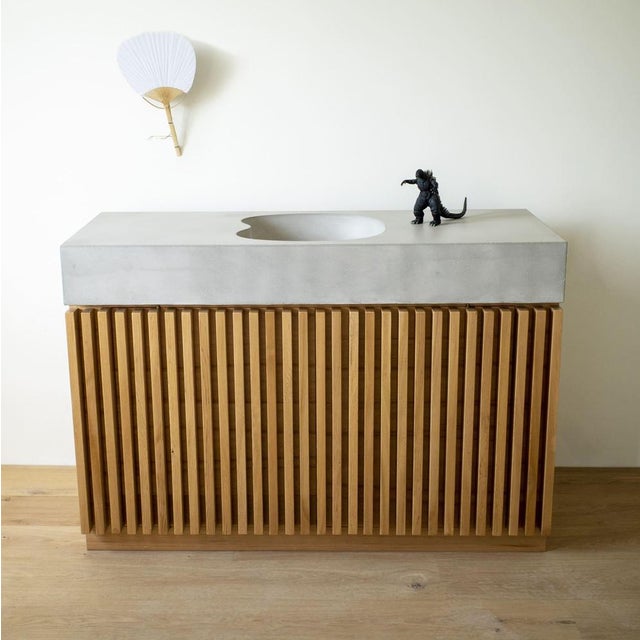 Ventaglio concrete and cedar vanity by baka studio limited edition dimensions: d 130 x w 48 x h 90 cm materials: concrete,...