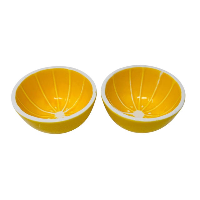 A vibrant and sculptural pair of realistic, hand-painted lemon-themed fruit bowls by Knobler, a premier maker of mid-...