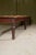 A good Victorian long footstool, in the original crusty stained pine finish, on six turned legs. For re-webbing and...