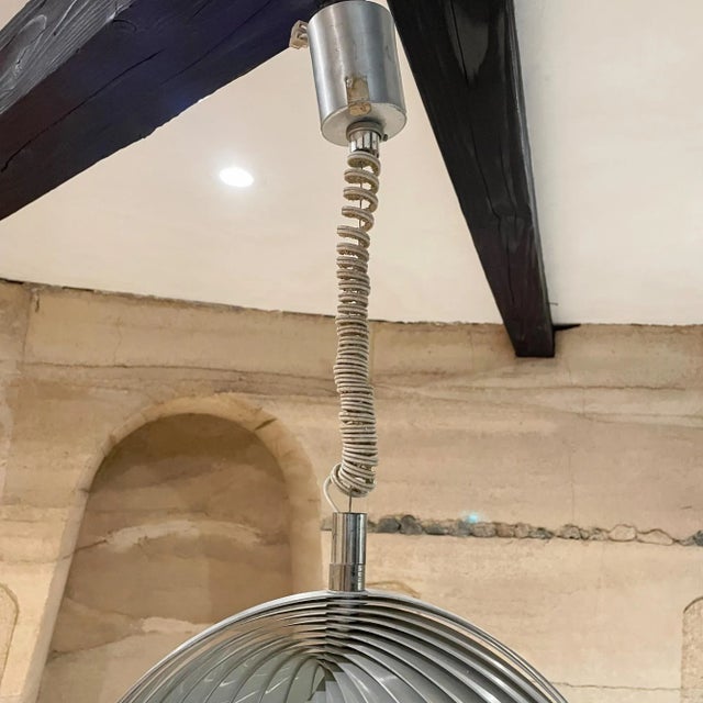 AMBIANIC presents Pendant Lamp From France sculptural vintage by Henri Mathieu Aluminum spiral shaped moon hanging Lamp...