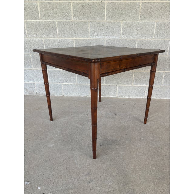 Description: Vintage Italian Faux Bamboo Fruitwood Game Table. Table shows finish wear on surface and is missing some...