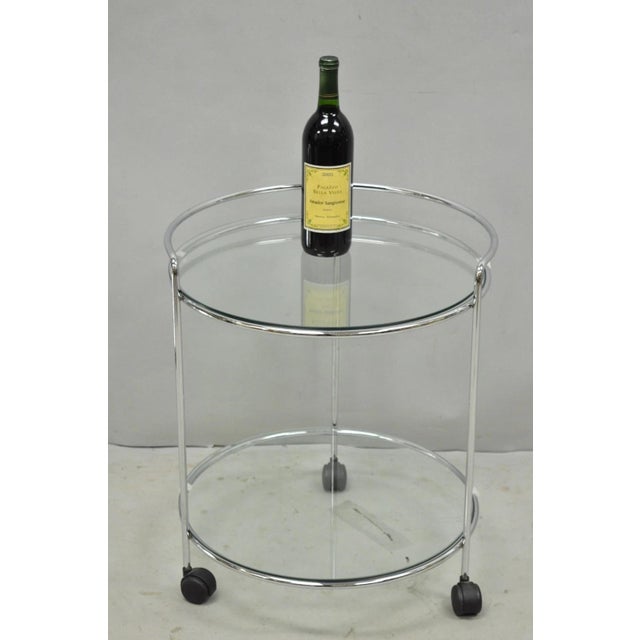 Vintage Mid Century Modern Chrome Round Glass 2 Tier Small Rolling Bar Cart Side Table. Circa Late 20th Century....
