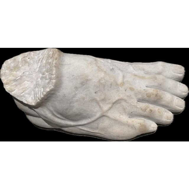 Unusual and highly decorative pair of sculptural Greek feet, carved in white Italian marble during the second half of the...