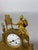 A gilt bronze clock depicting a young woman at her toilette. French work, Empire period, circa 1800. Gilt bronze, polished...
