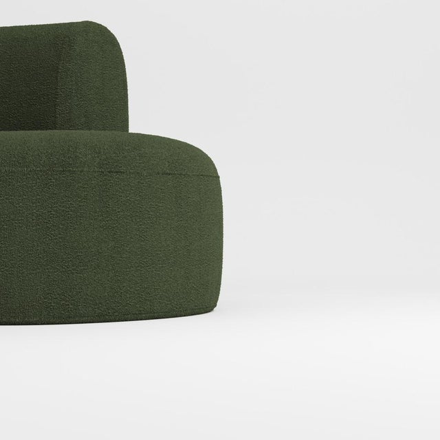Hug sofa is defined by clean, simple lines and a distinctive armrest detail. The armrest, half overlapping the seat...