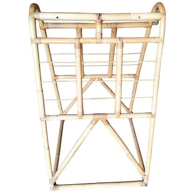 Restored 1950s mid-century modern display rack with iconic organic design. Crafted rattan, the piece features a striking...