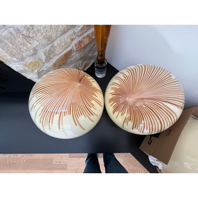 Circa 1970 Mid-Century Modern fixture with 3 spheres by La Murrina in Murano glass and brass hardware. The spheres are...