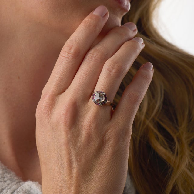 This charming Victorian cluster ring centers on a softly glowing rose cut diamond weighing approximately 0.50 carat,...
