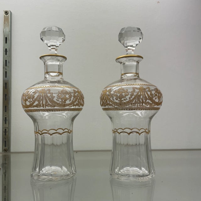 Pair of Vintage French Crystal St. Louis scent bottles with gilt decoration. The bottles are suitable for a bar decanter...