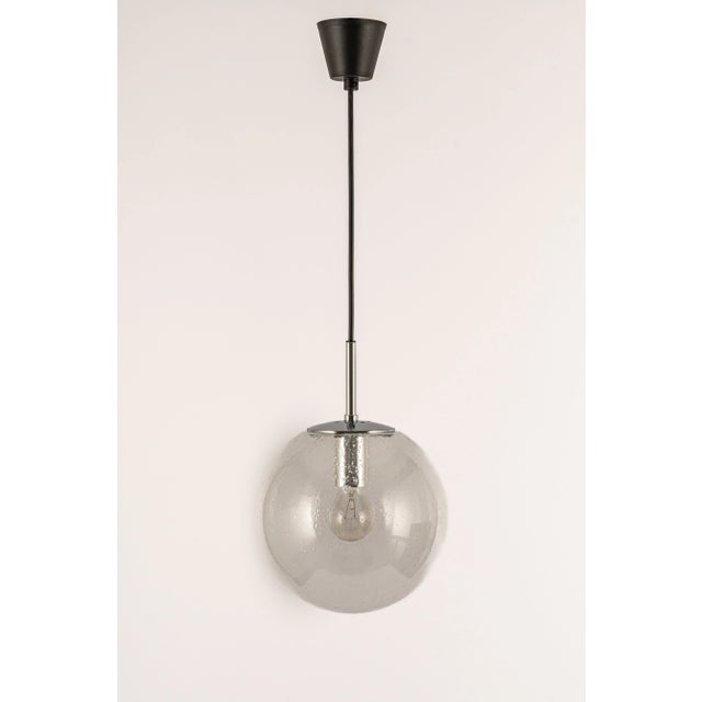Petite clear glass ball (hand-made) pendant, manufactured by limburg, germany between 1970 and 1979. Sockets: 1 x e27...