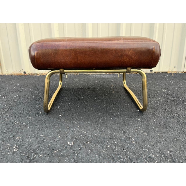 1960s adjustable footstool in brown vinyl made by Pearl Wick. The classic “Leg Lounger” is a fantastic product combining...