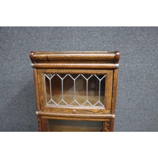 Rare quarter-size stacking bookcase attributed to Globe Wernicke, crafted in beautiful quarter sawn oak with rich tiger...