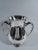 Turn-of-the-century Classical sterling silver trophy cup. Made by Tiffany & Co. in New York. Ovoid body, flared mouth, and...