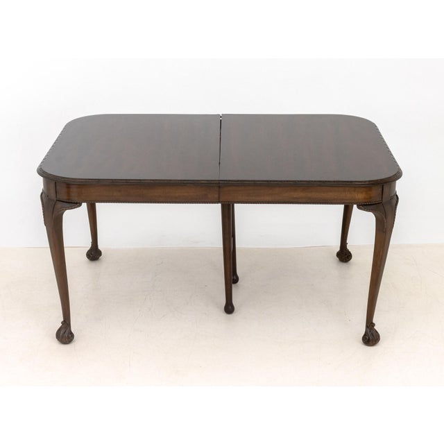 Queen Anne Style Mahogany Extending Dining Table, with three leaves above six cabriole legs, marked "Watertown Brothers...