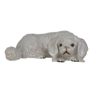 Vintage French White Tin Glaze Terracotta Pekinese Dog Sculpture With Glass Eyes For Sale