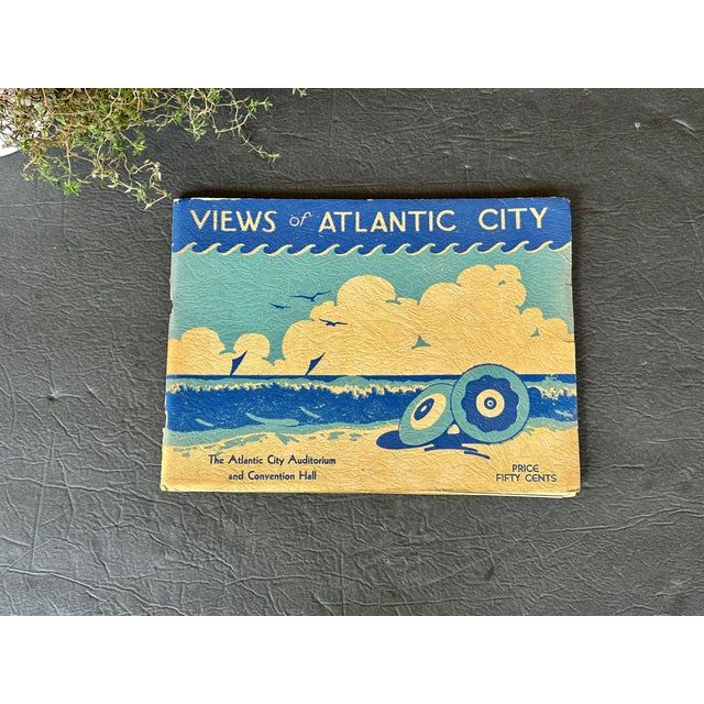 This vintage photo book has three 31 3/4" long double-sided fold-out pages at the back with panoramic photographs of the...