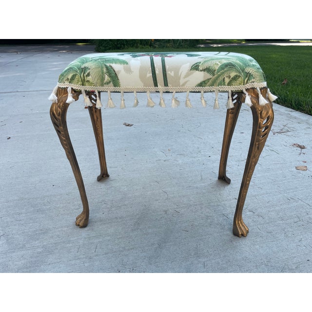 This newly-upholstered antique stool features gilded cast iron legs in the Art Nouveau style. The 15" long legs are...