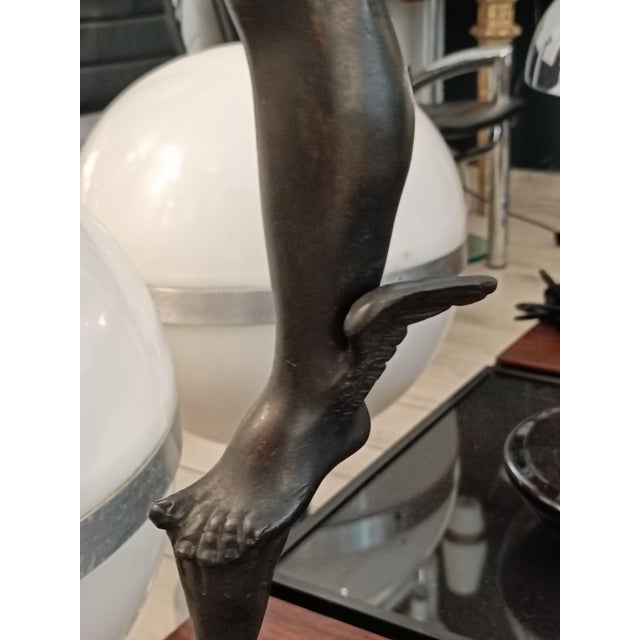 This sculpture depicts Mercury or Hermes, according to the Roman or Greek names for the gods. The original was sculpted by...