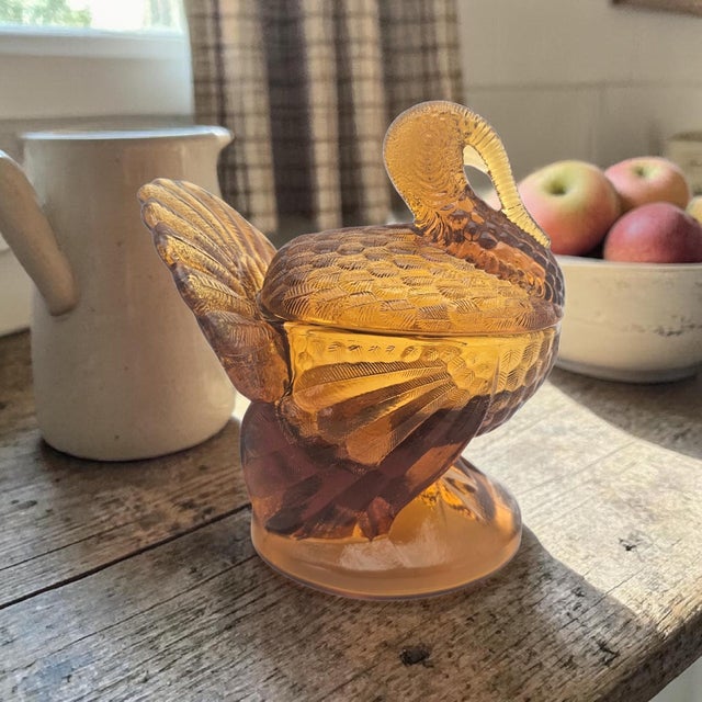 A Mid-Century figural covered candy dish in Amberina glass attributed to L.E. Smith, formed as a stylized turkey with...
