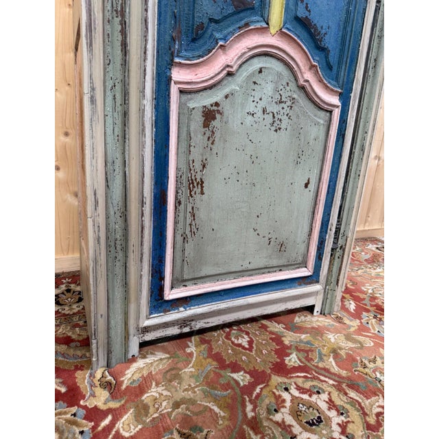 A single-door bonnetière in solid oak, louis xv period, 18th century, featuring an antique polychrome finish in successive...