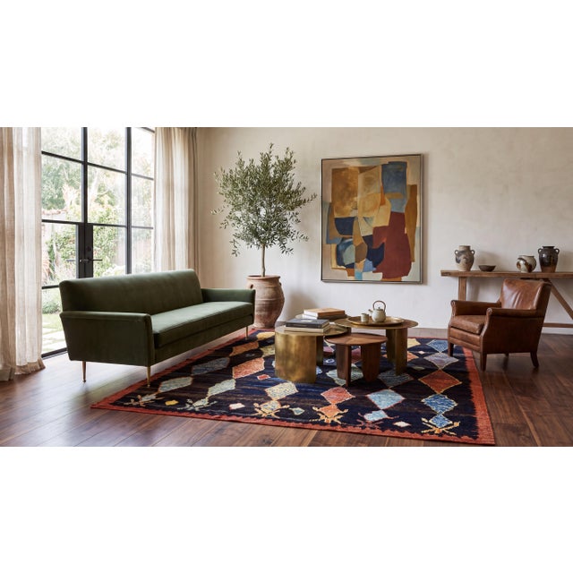 Elevate your space with this modern Moroccan-style hand-knotted wool area rug, crafted with artisanal detail ideal for...