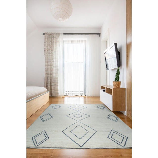 Selene Moroccan Ivory Hand Knotted Wool Rug, Country of Origin: India. This piece offers a sophisticated interpretation of...