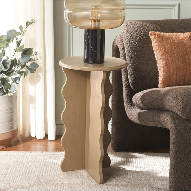 Add a touch of artistry and elegance to your home with the Lilith Wavy Accent Table in a stunning desert brown finish....
