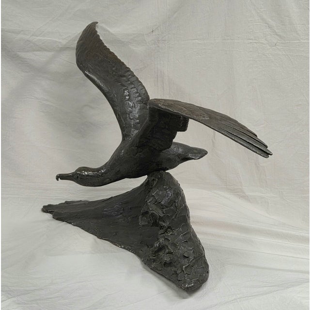 A stunning patinated bronze sculpture of an albatross in flight by French artist Maximilien Louis Fiot (1886-1953). On the...