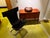 Chair with a bold design, chromed tubular frame and ergonomic seat in patinated black leather; an aesthetic that is both...