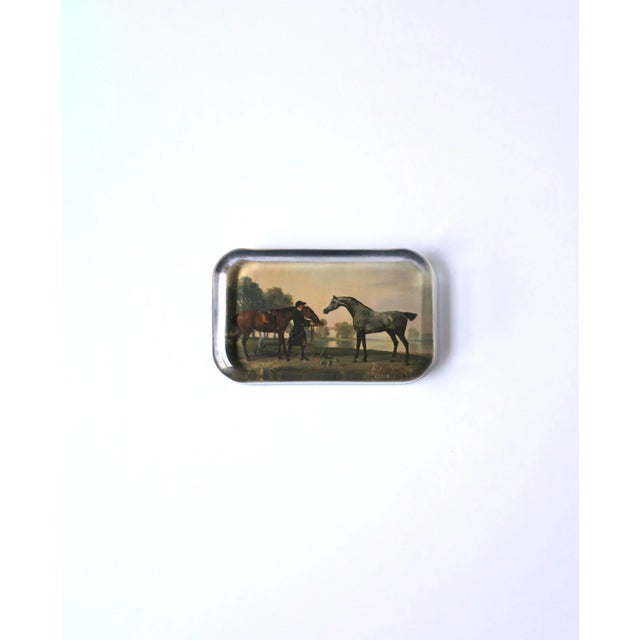 A glass and paper decoupage paperweight of an English country scene with horses, circa 1970s, England. A great piece for a...