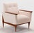 This pair of armchairs showcases refined simplicity, with a subtle tilt in the base and seat that adds understated...