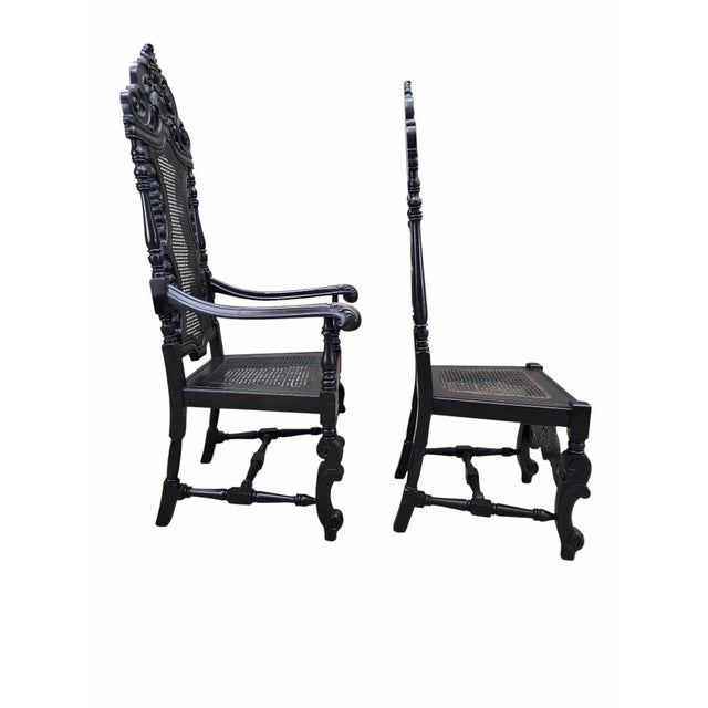 Antique Victorian Carved Walnut Caned Throne Chairs by Michigan Chair Company – Set of 2 A striking set of two antique...
