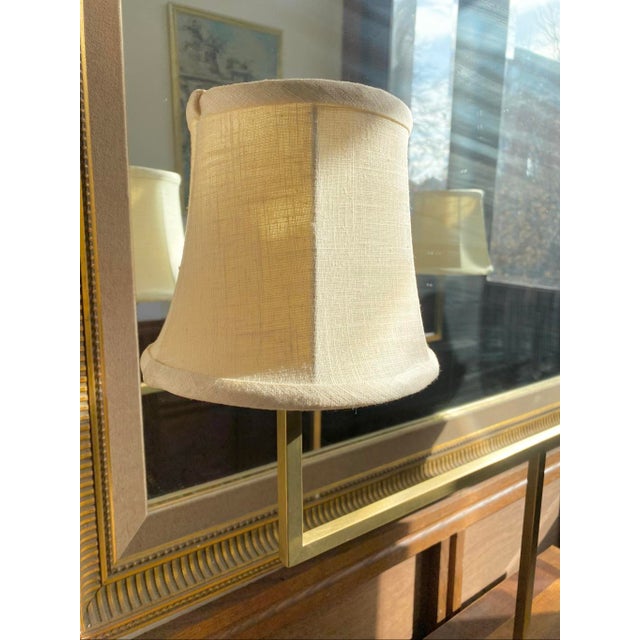 20” Wide 20” Depth 39” Hight The symmetrical "T-bar" design supports two elegantly tapered shades in a warm cream linen,...
