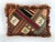 Whimsical patchwork pillow in rich fabrics and fringe. In like new condition.