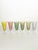 Elegant set of six French champagne coupes crafted in fine colored glass. Each coupe features a delicately shaped bowl...