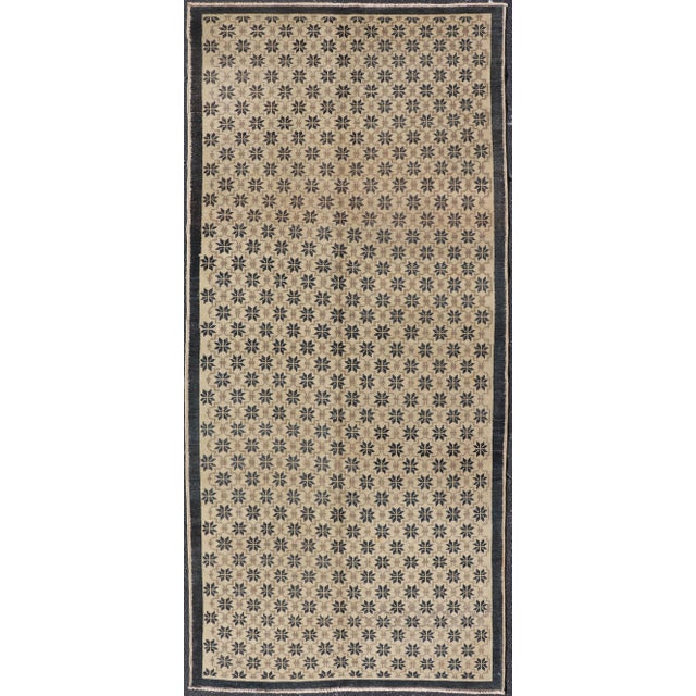 Measures: 4'4 x 9'9. Onyx and Cream Vintage Turkish Oushak Rug With Latticework and Poinsettia Shapes 4'4 X 9'9. Keivan...